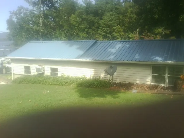Blue metal roof running the length of a single story home in Cashmere